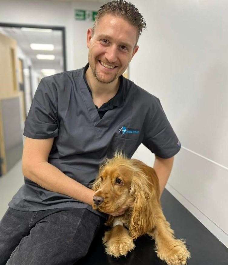 Jarvis the cocker spaniel with veterinary surgeon Federico Piccinno from Anderson Abercromby Veterinary Referrals
