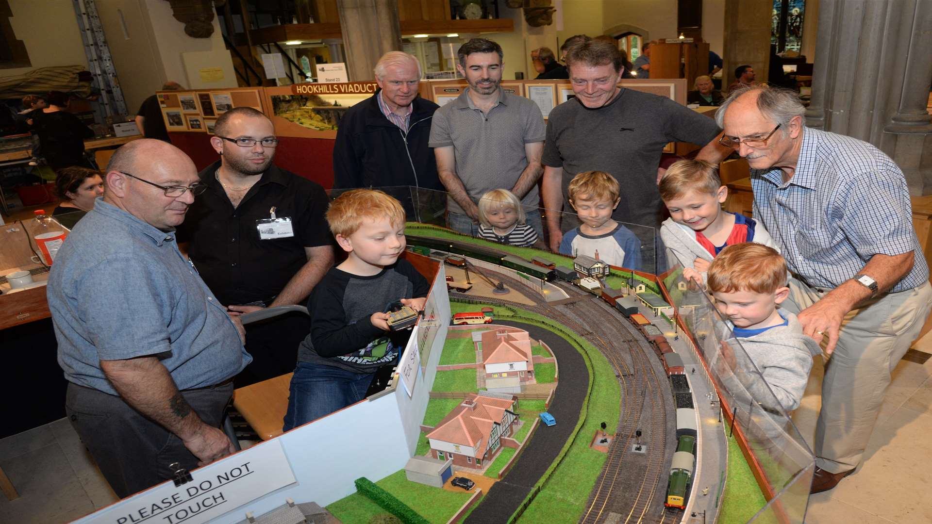 Ben Kinderman who attends the Sunday School and Church at St Michael's, Wilmington was invited to take control of one of the trains on the Hawkenbury layout at the model railway exhibition in the church and hall on Saturday. Picture: Chris Davey
