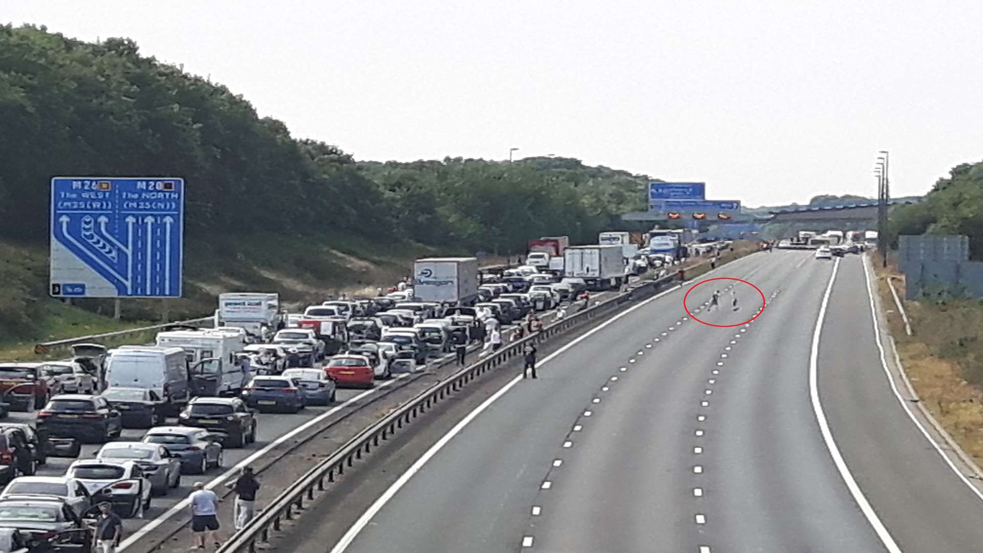 People play football on the closed M20 - again