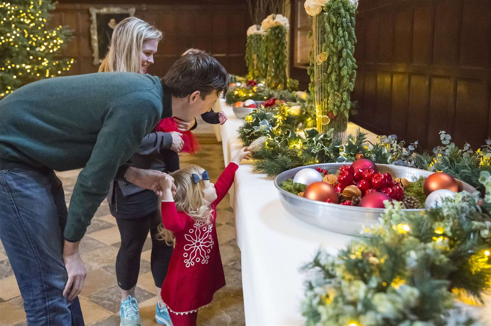 Visitors admiring the festive Christmas decorations at Knole Picture: National Trust/James Dobson