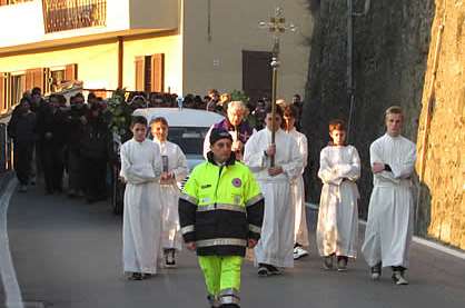 A cross leads the mourners at the funeral of Joele Leotta. Picture: www.casateonline.it