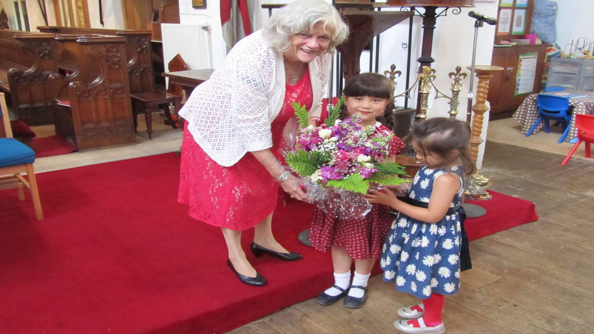 Sadie Aplin-Fu and Kimberley Plumb present Ann Widdecombe with flowers