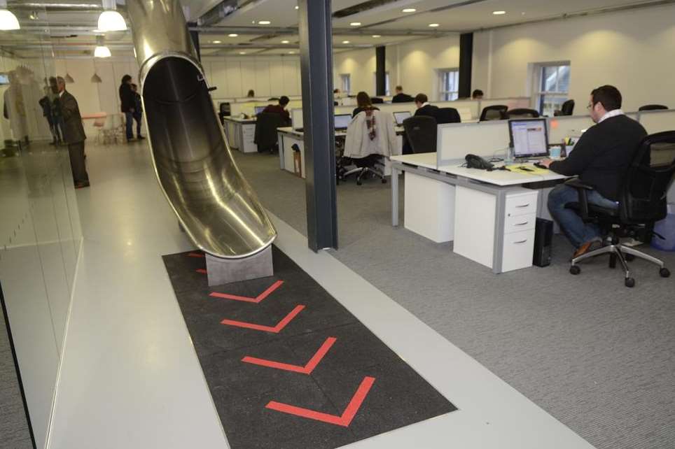 Staff at The Workshop in Folkestone can slide to their desks