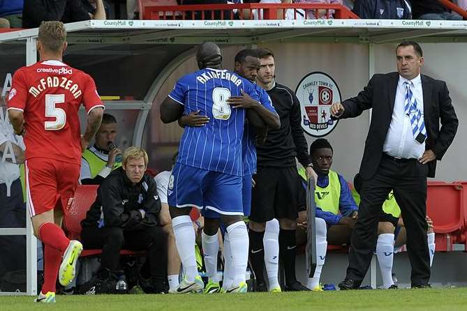 Manager Martin Allen sees his offer of a handshake turned down as Adebayo Akinfenwa is replaced by Myles Weston. Picture: Barry Goodwin
