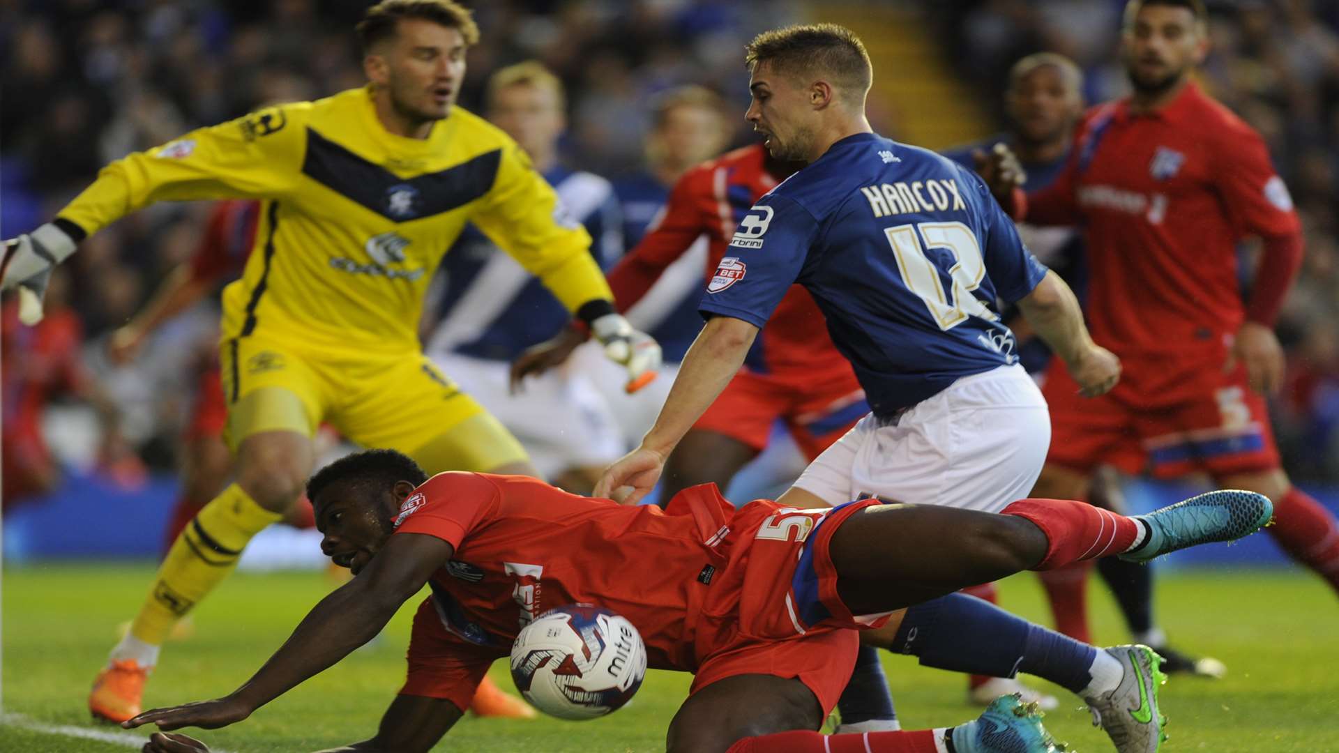 Adedeji Oshilaja takes a tumble as Gills crash out of the Capital One Cup against Birmingham Picture: Barry Goodwin