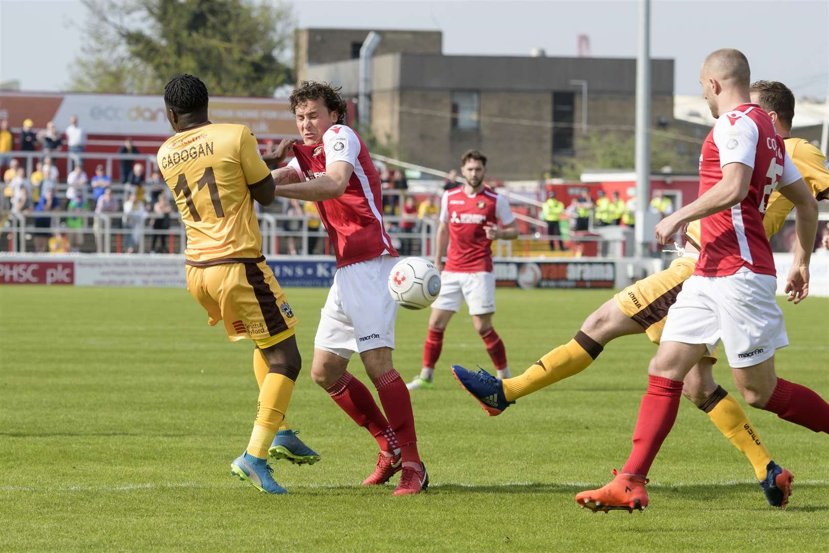 Lawrie Wilson reacts as Sutton's Jamie Collins makes a big clearance Picture: Andy Payton