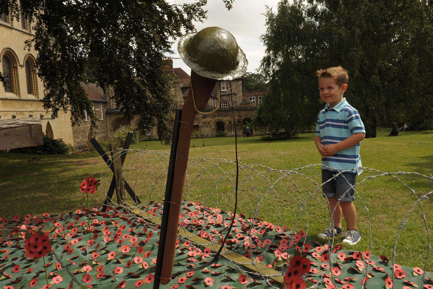 Riley Webster, 4, at the garden memorial at Rochester Cathedral