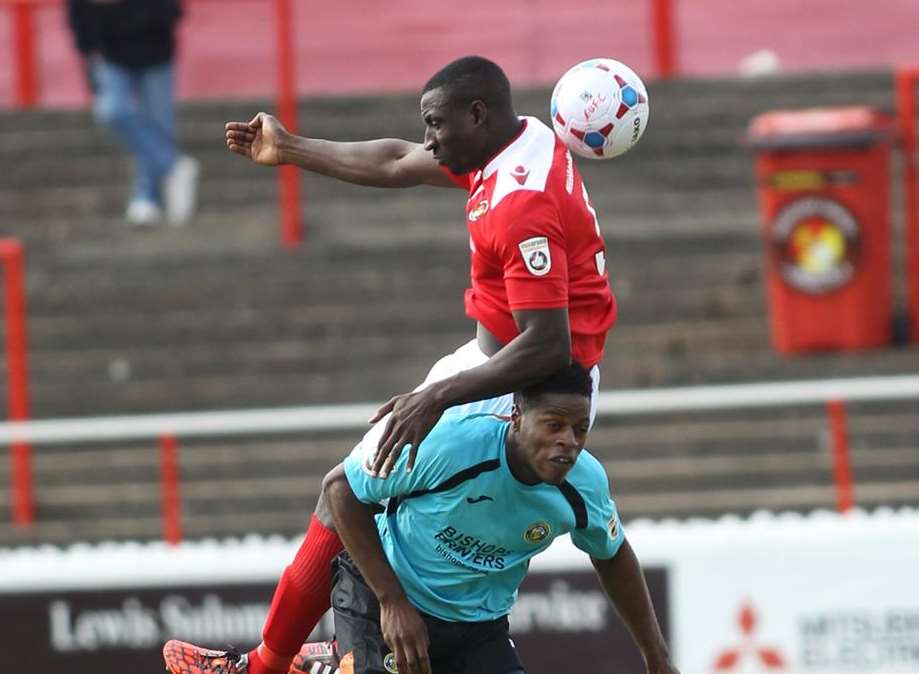 Anthony Acheampong gets up well against Havant forward JJ Hooper Picture: John Westhrop