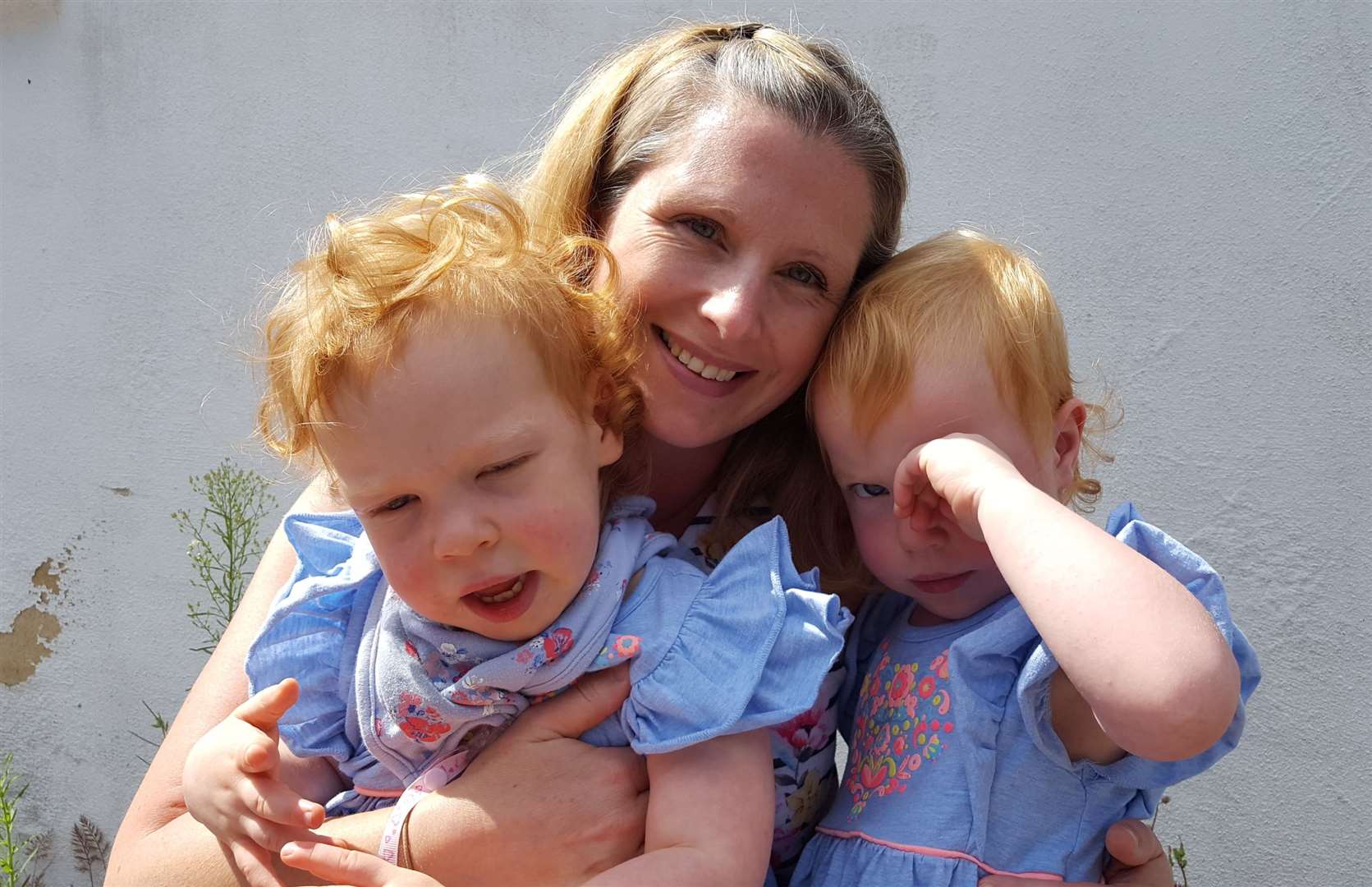 Mum Lucy Toner is among thousands who have been helped by the charity. Pictured with twins Evie (left) and Esme (right)