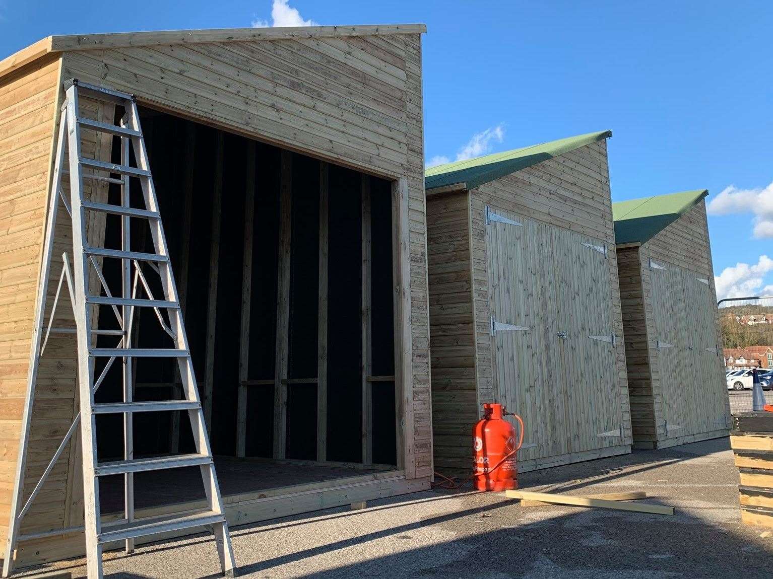 Wooden huts are being created on Folkestone Harbour Arm for the Christmas market. Photo: Folkestone Harbour Arm