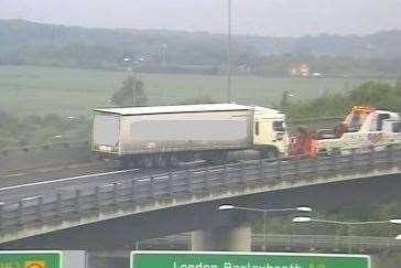 The lorry is being recovered from the M25 slip road