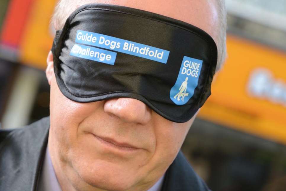 Ashford MP Damian Green donned a blindfold for the Guide Dogs' challenge. Picture: Gary Browne