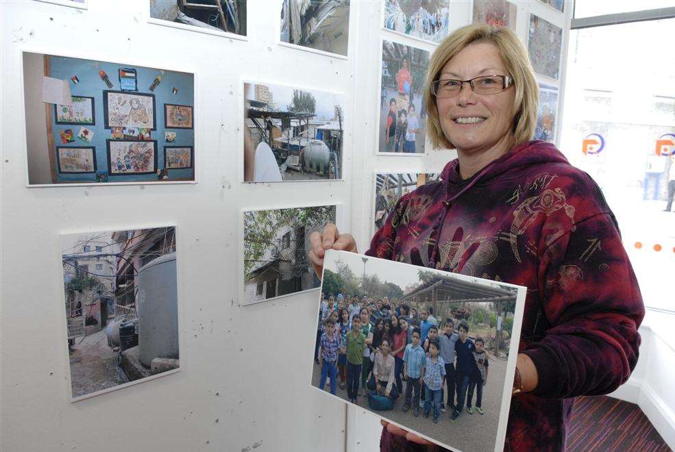 Artist Paula Trower who was part of a group that took part in a project to bring art to a park in Beirut with at the exhibition of photographs of the trip at The Gateway in Sheerness High Street.