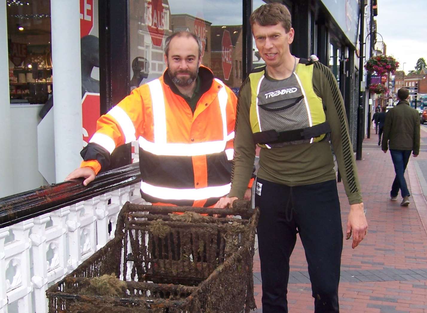 Tonbridge Flood Warden Coordinator, Carl Lewis (left) with Chair of Tonbridge Canoe Club, Clive Neale with one of the 15 dredged trolleys taken from the River Medway