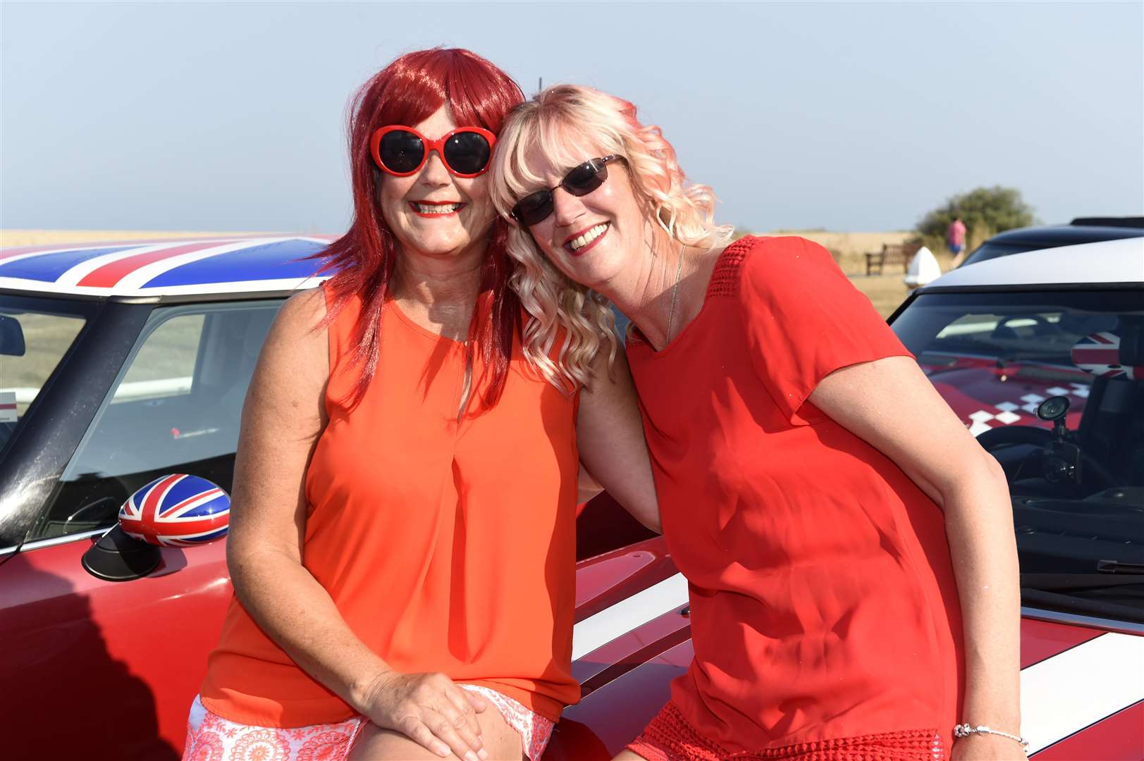 Tracy Carr and Michelle Parry enjoy the hot temperatures on Walmer seafront for the Deal Carnival yesterday. Picture: Tony Flashman