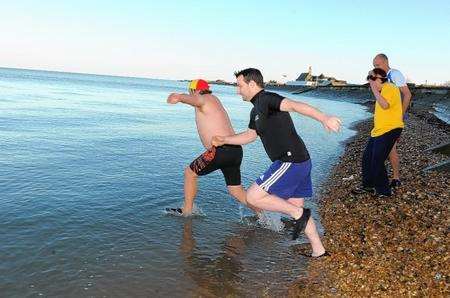 Members of Sheerness Swimming Club and Lifeguard Corps take to the chilly seas