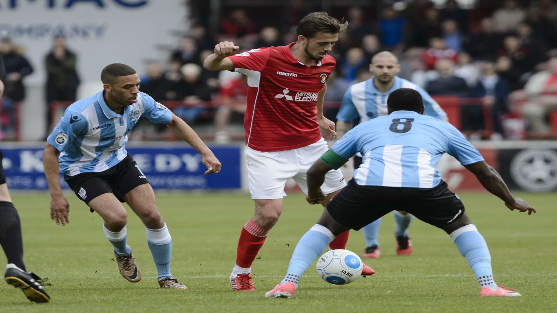 Jack Powell takes on two Hampton players during Ebbsfleet's play-off semi-final Picture: Andy payton