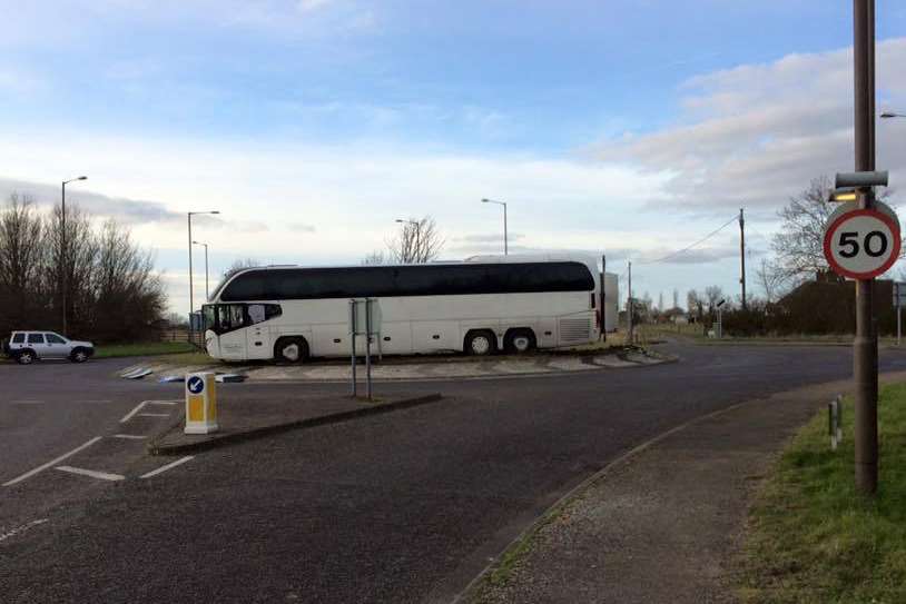 And the next stop is....a coach stuck on the roundabout at Brookland.