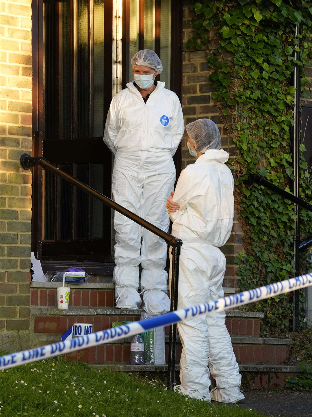 Forensic officers outside the flat in Grampion Close. Picture: Andy Clark