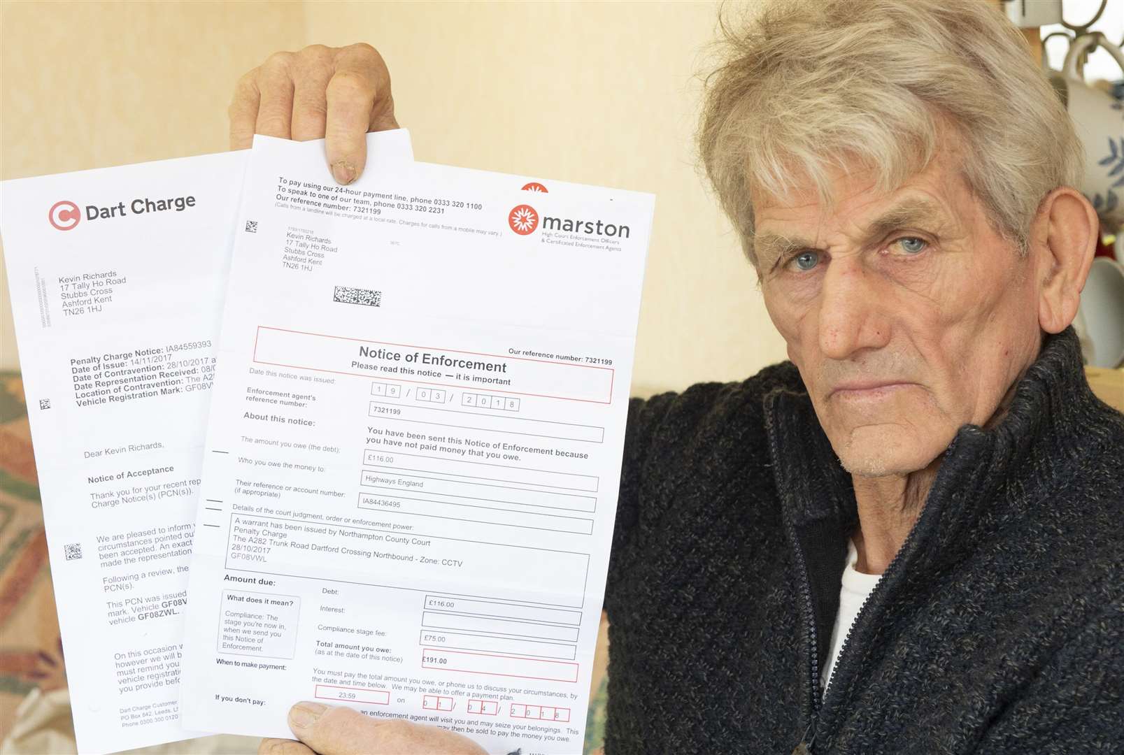 Kevin Richards, of Boldshaves Lane, Woodchurch, shows paperwork in his battle with Highways England
