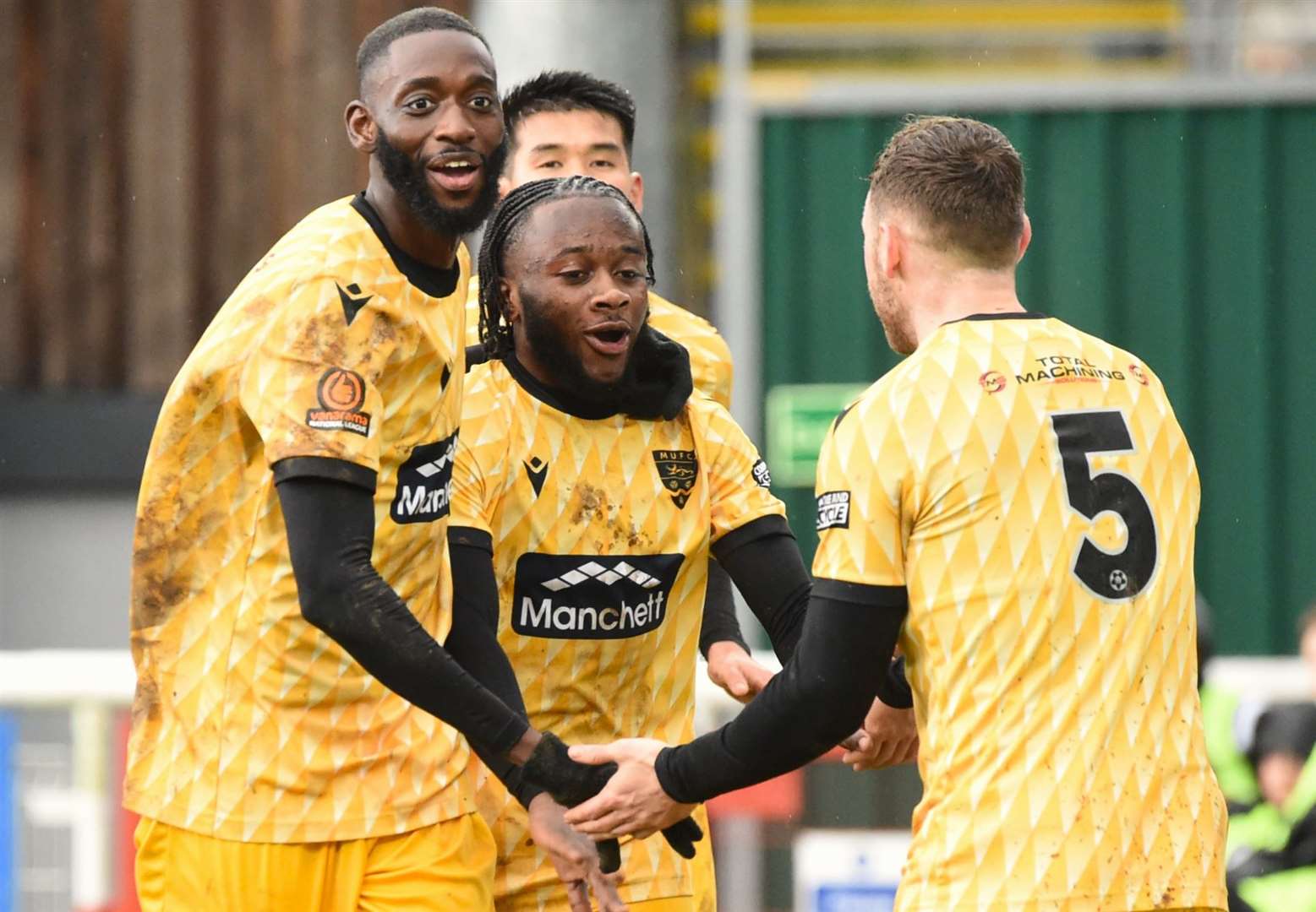 Jephte Tanga celebrates his goal with Mo Faal and George Fowler. Picture: Steve Terrell