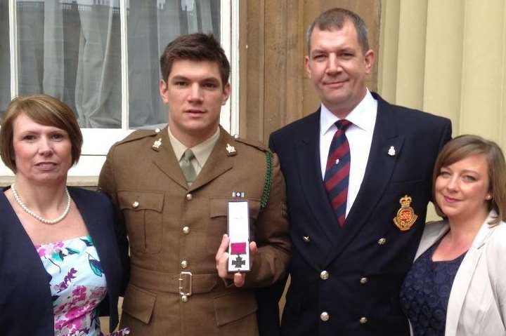 The family of L/Cpl James Ashworth pick up the Victoria Cross he was posthumously awarded at Buckingham Palace