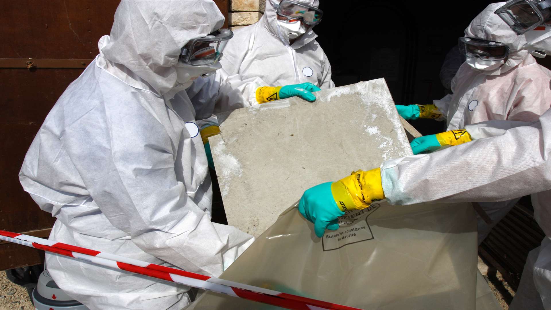 Asbestos is removed from building. Library image.
