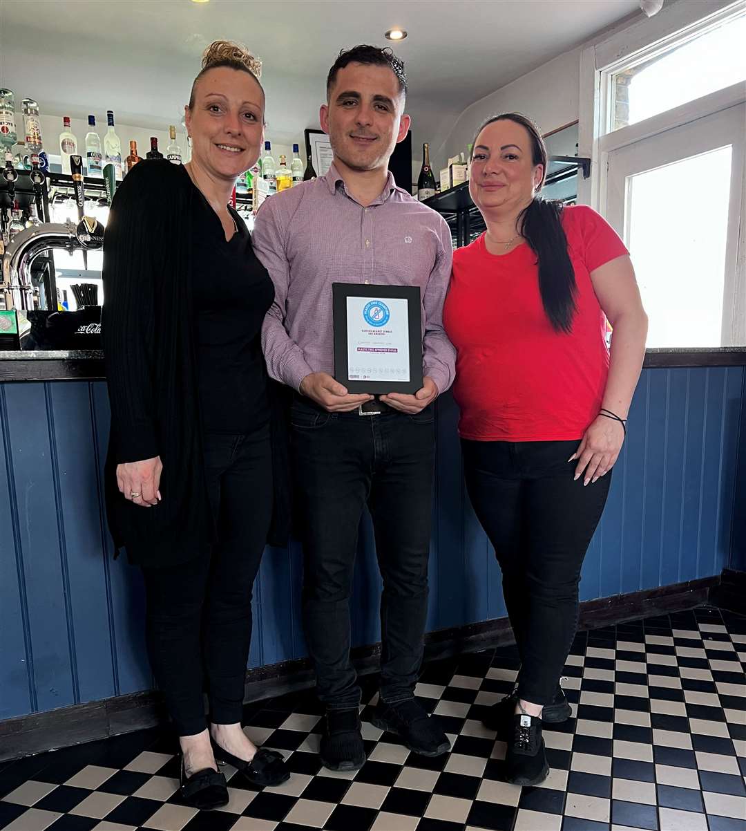 Vinni Maka of The Yeoman with his award, pictured with staff members Kelly Bailey (left), and Emma Louise Paige