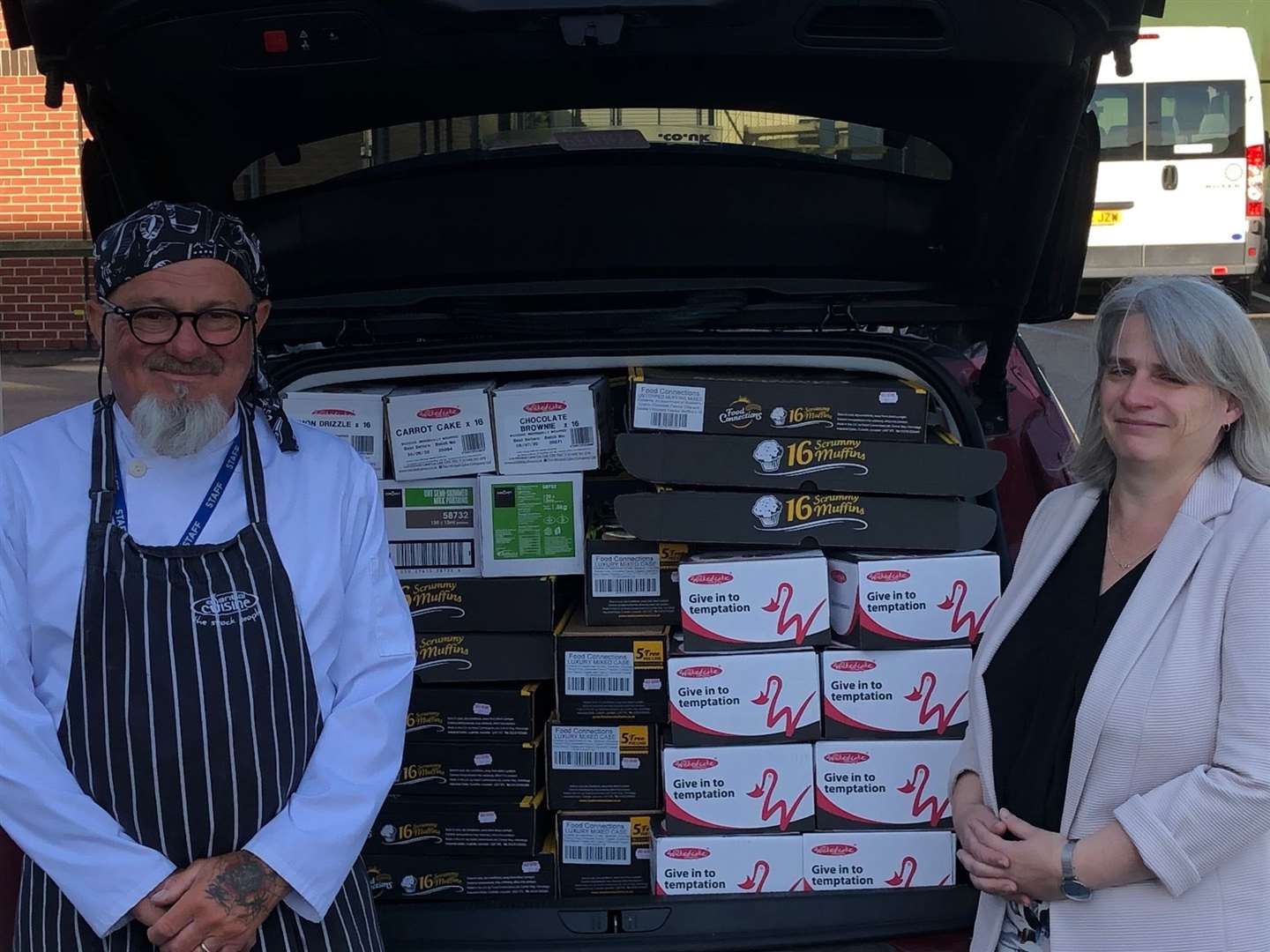 Restaurant manager Kevin Douglas and head teacher Tracey Savage with some of the donated items