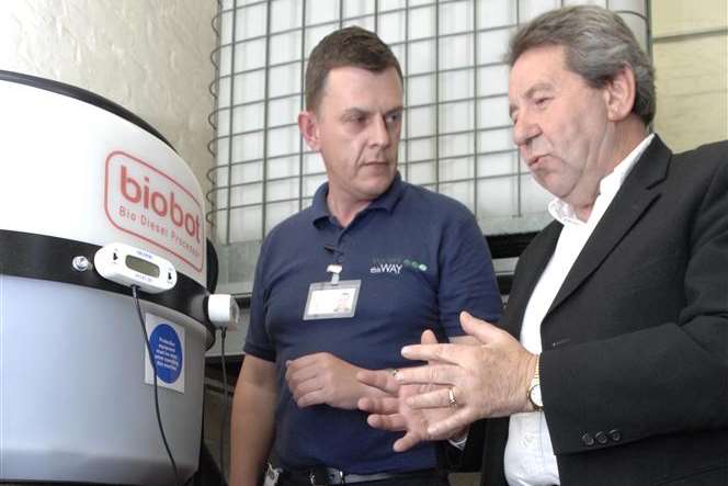 Zack Owen explains the manufacturing process for Bio Diesel to Gordon Henderson