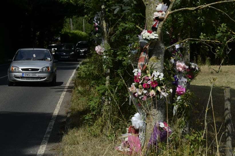Floral tributes left at the scene of the fatal crash in Sandwich Road, Waldershare. Picture: Gary Browne
