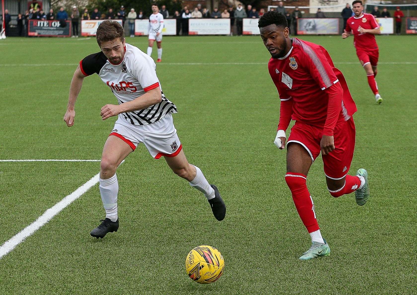 Whitstable man-of-the-match Josh Williams speeds down the wing as he gets past Deal's Billy Munday. Picture: Les Biggs
