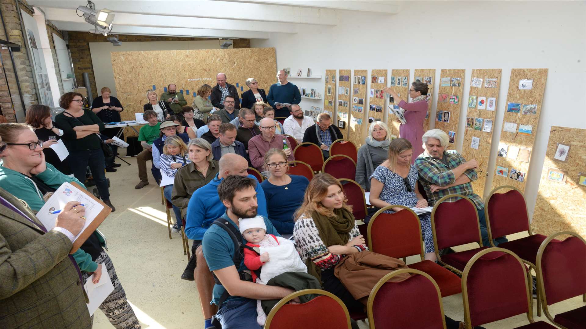 Bidders at the postcard auction held at the Harbour Arm Gallery, Margate on Saturday. Picture: Chris Davey