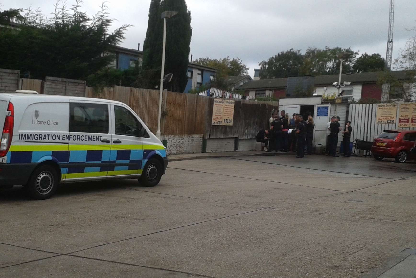 The moment when immigration enforcement raided the Sutton Road car wash. Pic: Geoff Crittenden