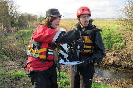 Kent Search and Rescue volunteers Darren Wimsett and Jo Kenny survey the Stodmarsh nature reserve.