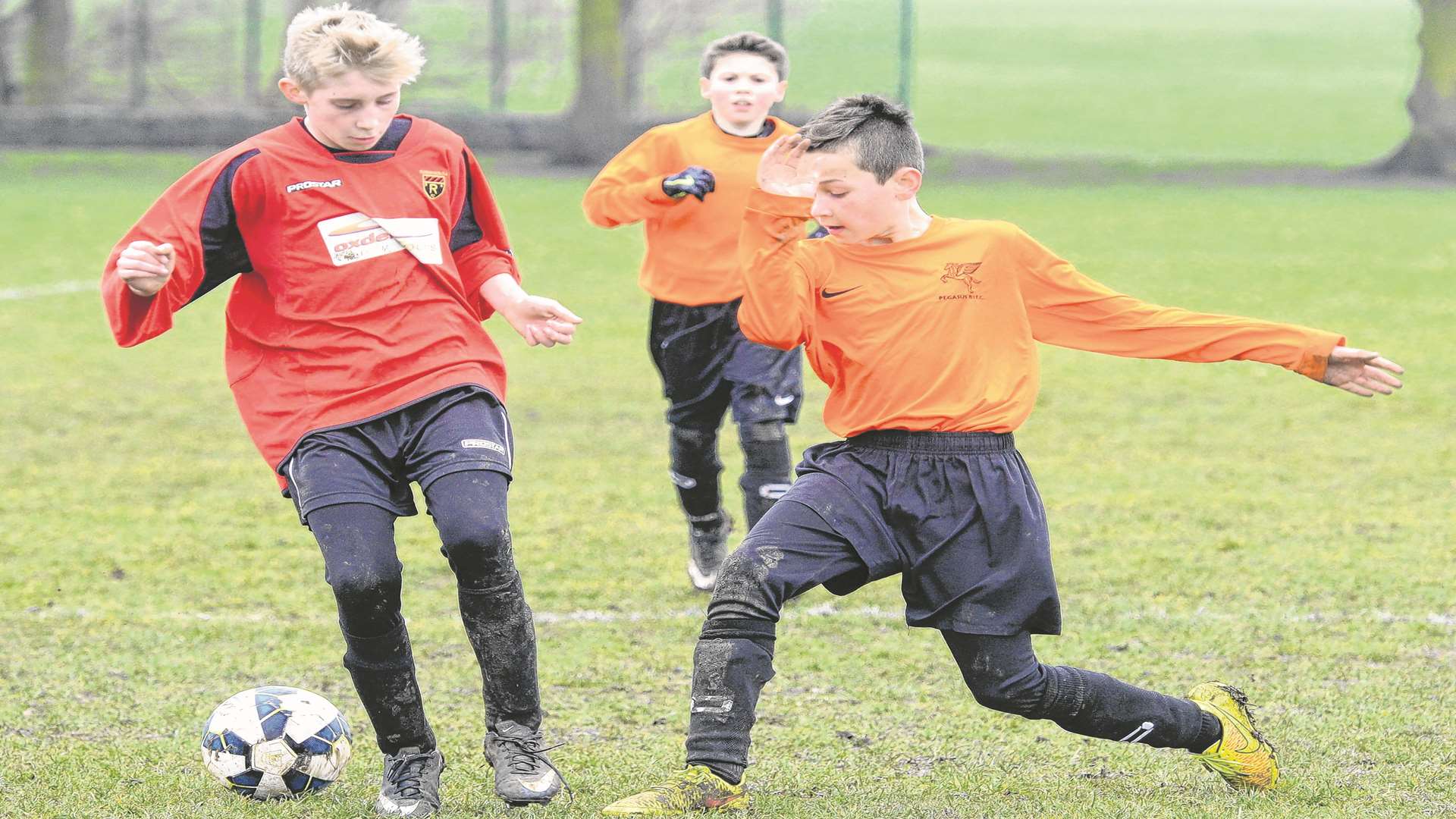 Rainham 84 under-12s, red, in action against Pegasus 81 Flyers under-12s on Sunday. Picture: Gary Browne FM3652409