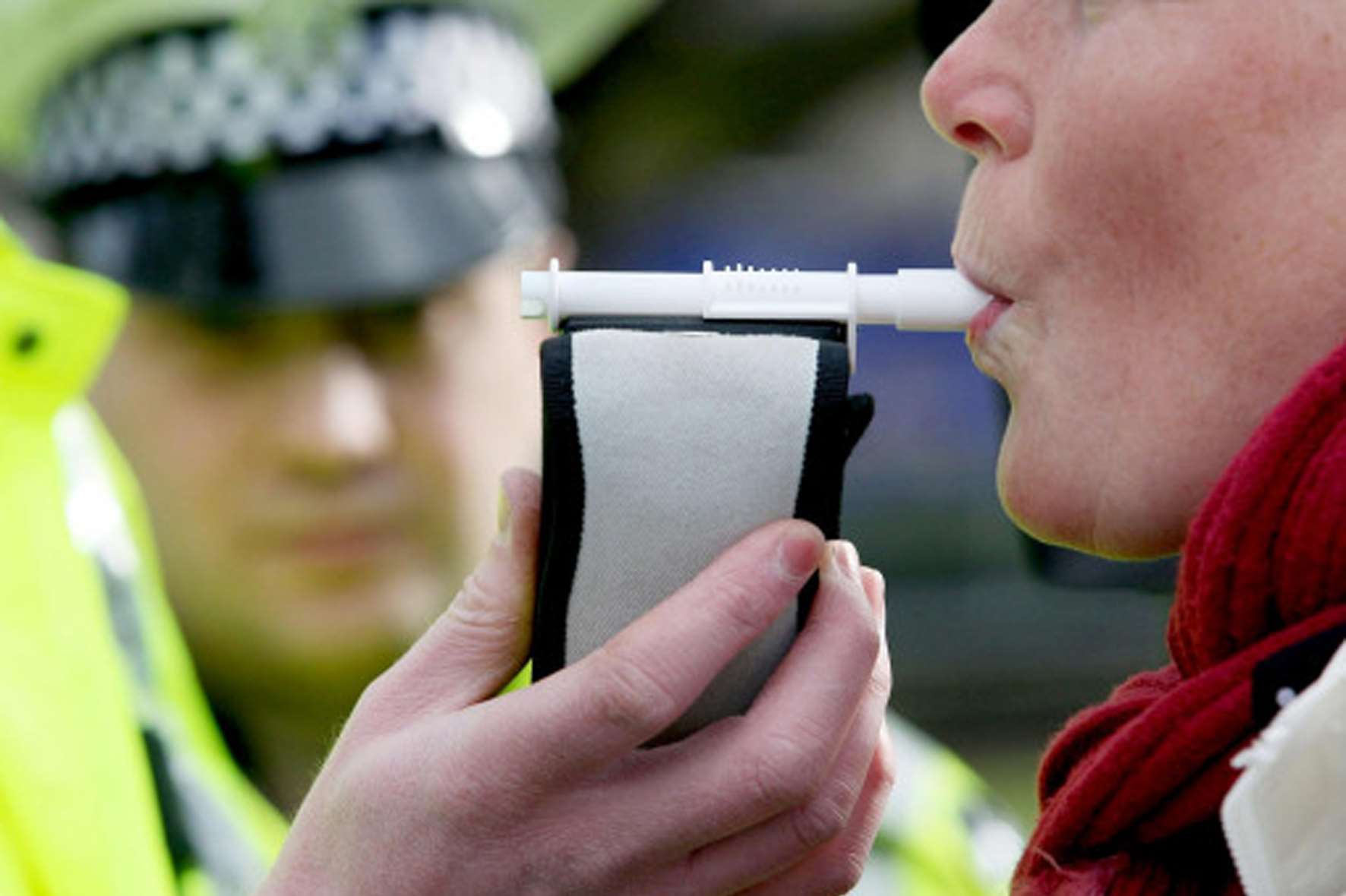 A driver being breathalysed. Stock image