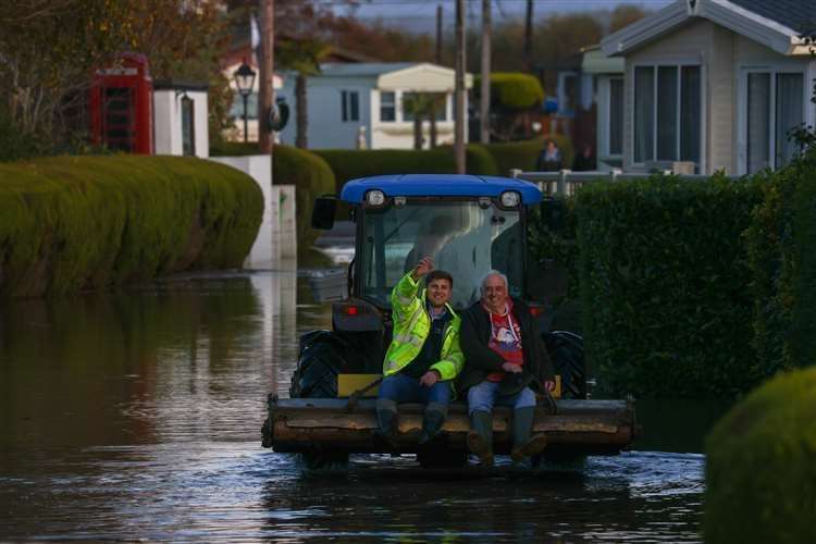Neighbours were seen riding tractors to get around in Yalding during recent floods. Picture: UKNIP