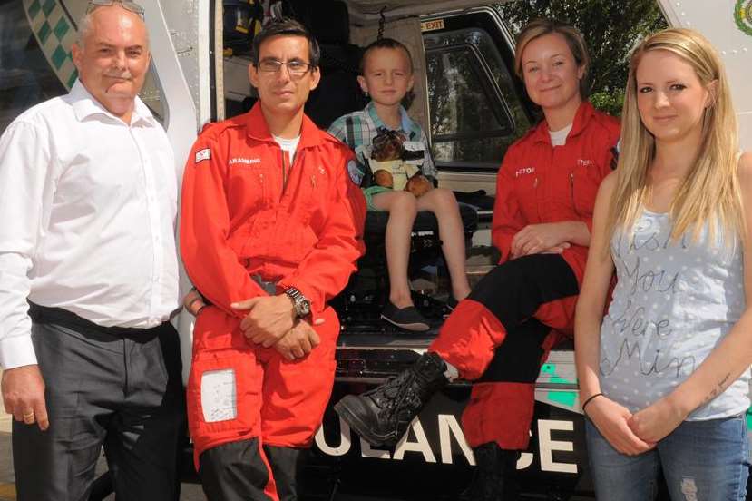 Little Kye Sharrad (centre) meets Dr Stephanie Tilston and paramedic Jez Loseby with grandfather Jem and mother Kerry