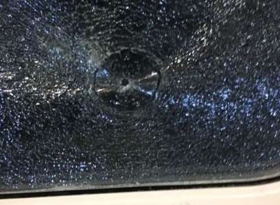 Twitter user @Adam_48 posted this photo of the train window where the bullet hit