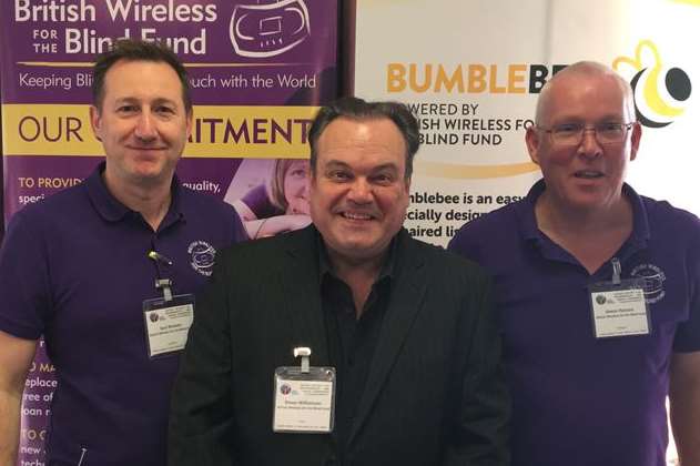 Shaun Williamson, joins British Wireless for the Blind Fund staff Saul Watson and Simon Parsons at the Rotary regional conference.