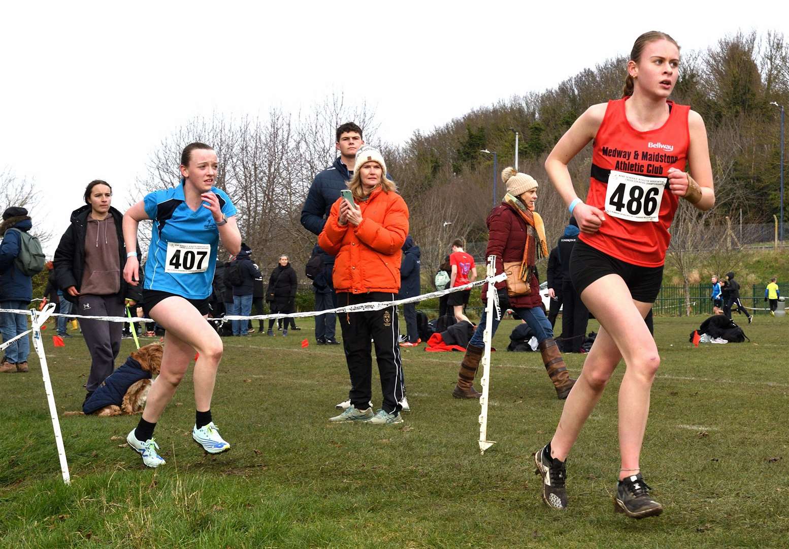 Heidi Hughes (No.486) for Swale and Catriona Reid (No.407) racing for Ashford & Weald in the intermediate girls’ category. Picture: Simon Hildrew