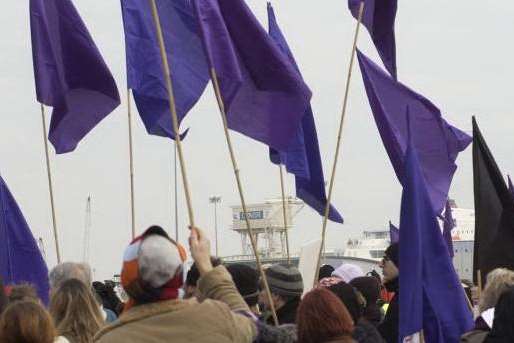 Animal rights campaigners at Dover with purple flags