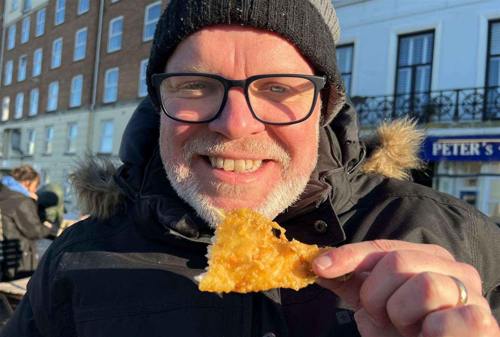 Your reviewer braves the chilly air to scoff his free bit of fish