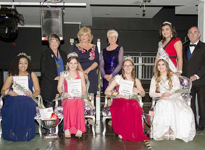Senior court: Princess Amelia Lawson, 14, Queen Kelsi Endean, 14, Princess Hannah Brice, 16, with outgoing queen Claudia Cousin. Back row: President Marlene Burnham, Tracy Carr, Rose Tricky, Chantelle Rowley and John Tricky