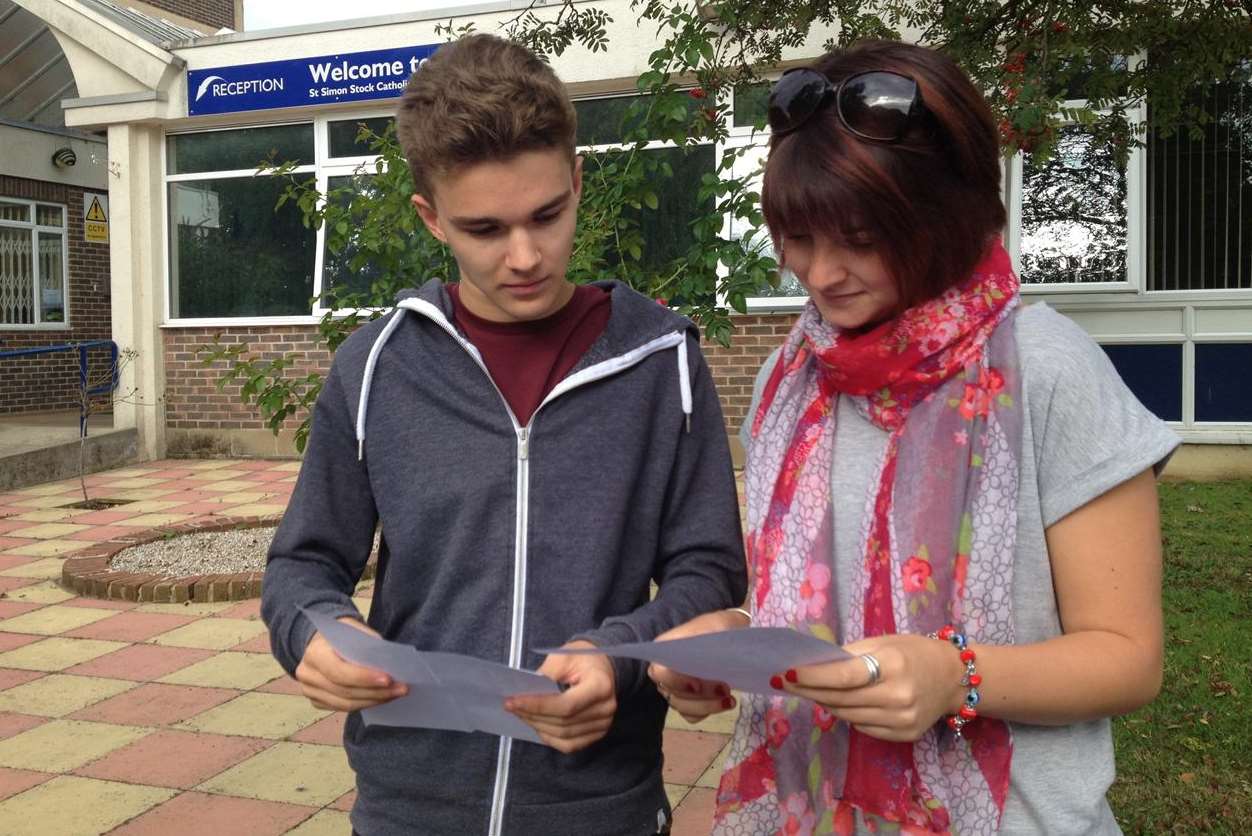 Connor Hill and Jordan Proyer open their results at St Simon Stock School in Maidstone.