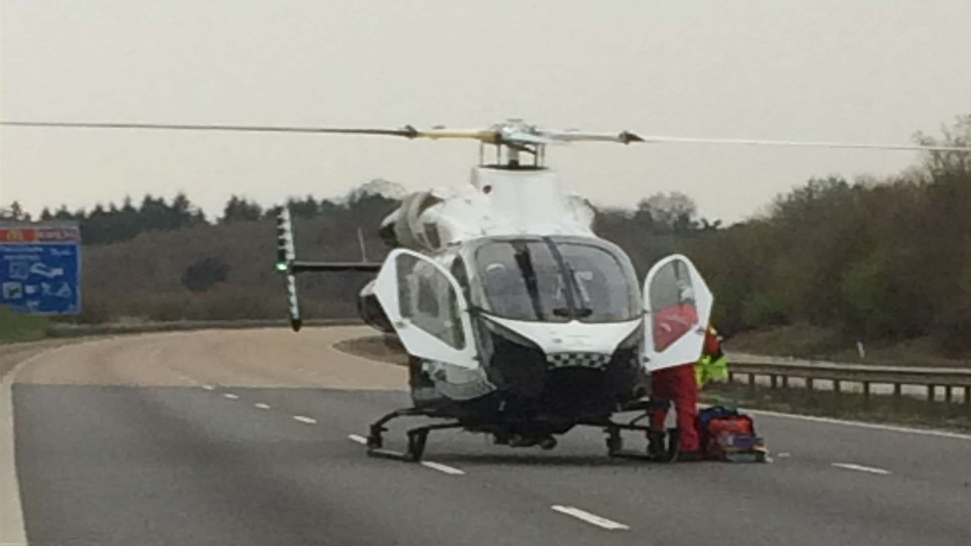 The air ambulance lands on the M20. Picture: Claire Reeves