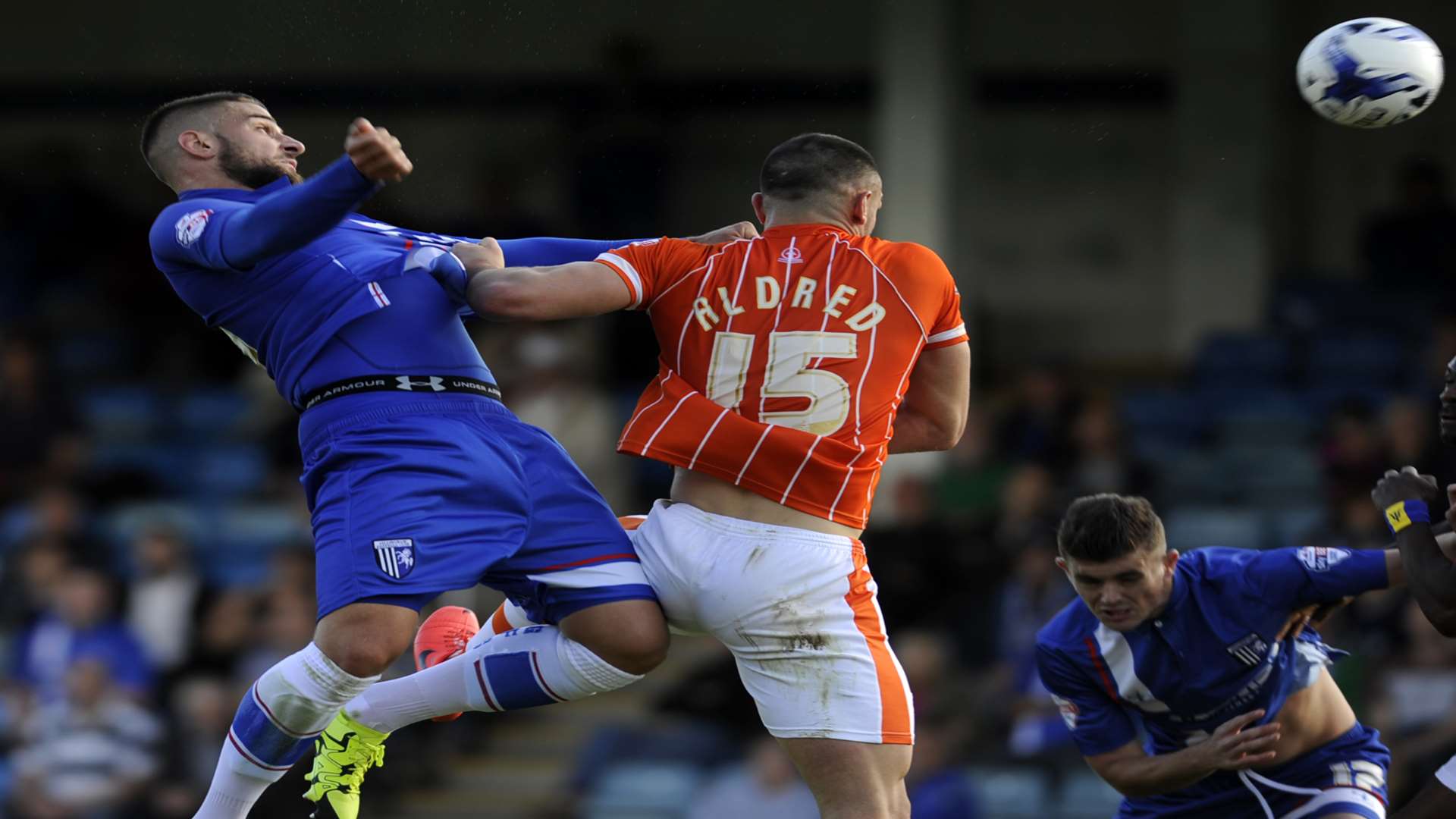 Gills' Max Ehmer beats Blackpool's Tom Aldred in the air. Picture: Barry Goodwin