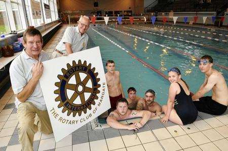 Rotary Club members (far left) and Roy Copper (second from left) with some of the swimathon participants
