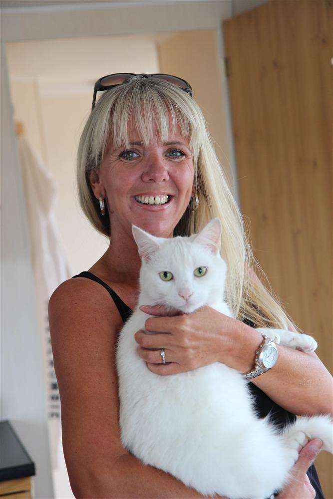 Charlie the cat and his delighted owner Michelle Dobson